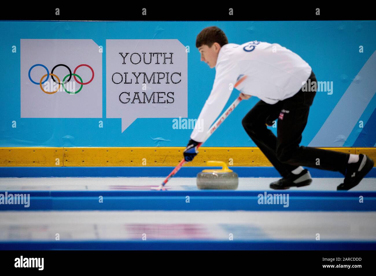 Team GB’s Ross Craik (15) in the curling mixed doubles with teammate Natalie Wiksten (DEN) during the Lausanne 2020 Youth Olympic Games Stock Photo