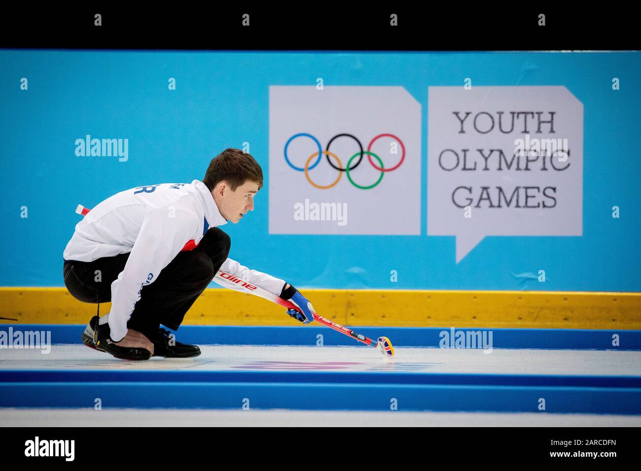 Team GB’s Ross Craik (15) in the curling mixed doubles with teammate Natalie Wiksten (DEN) during the Lausanne 2020 Youth Olympic Games Stock Photo