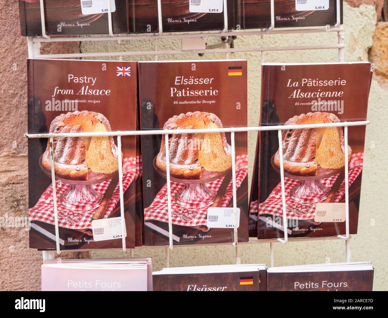Recipe books for traditional alsace patiseerie and kugelhopf for sale outside a shop in Riquewihr Alsace France Stock Photo