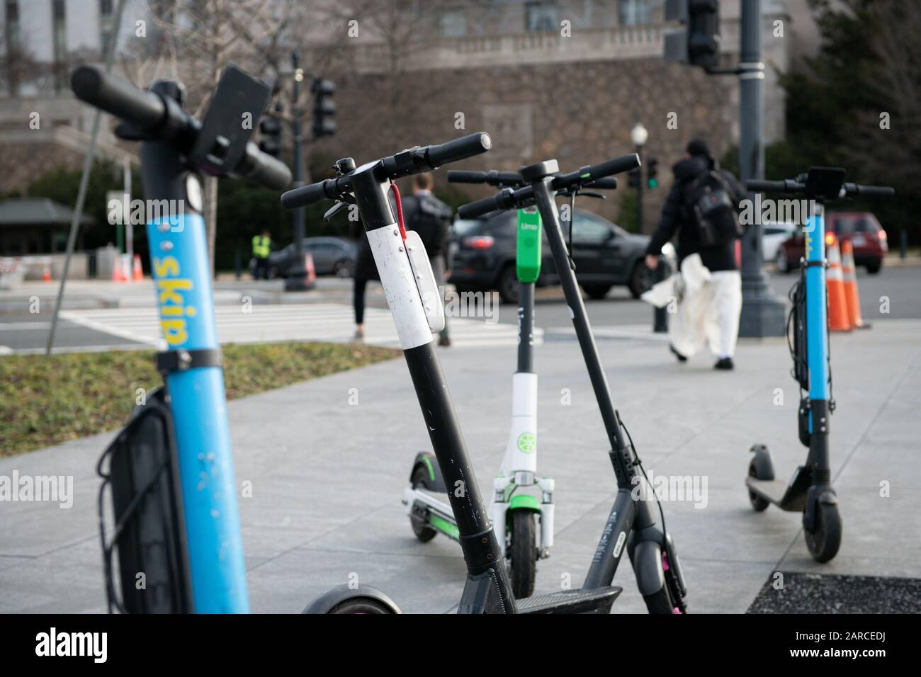 Dockless electric scooters parked on a sidewalk near the National Mall