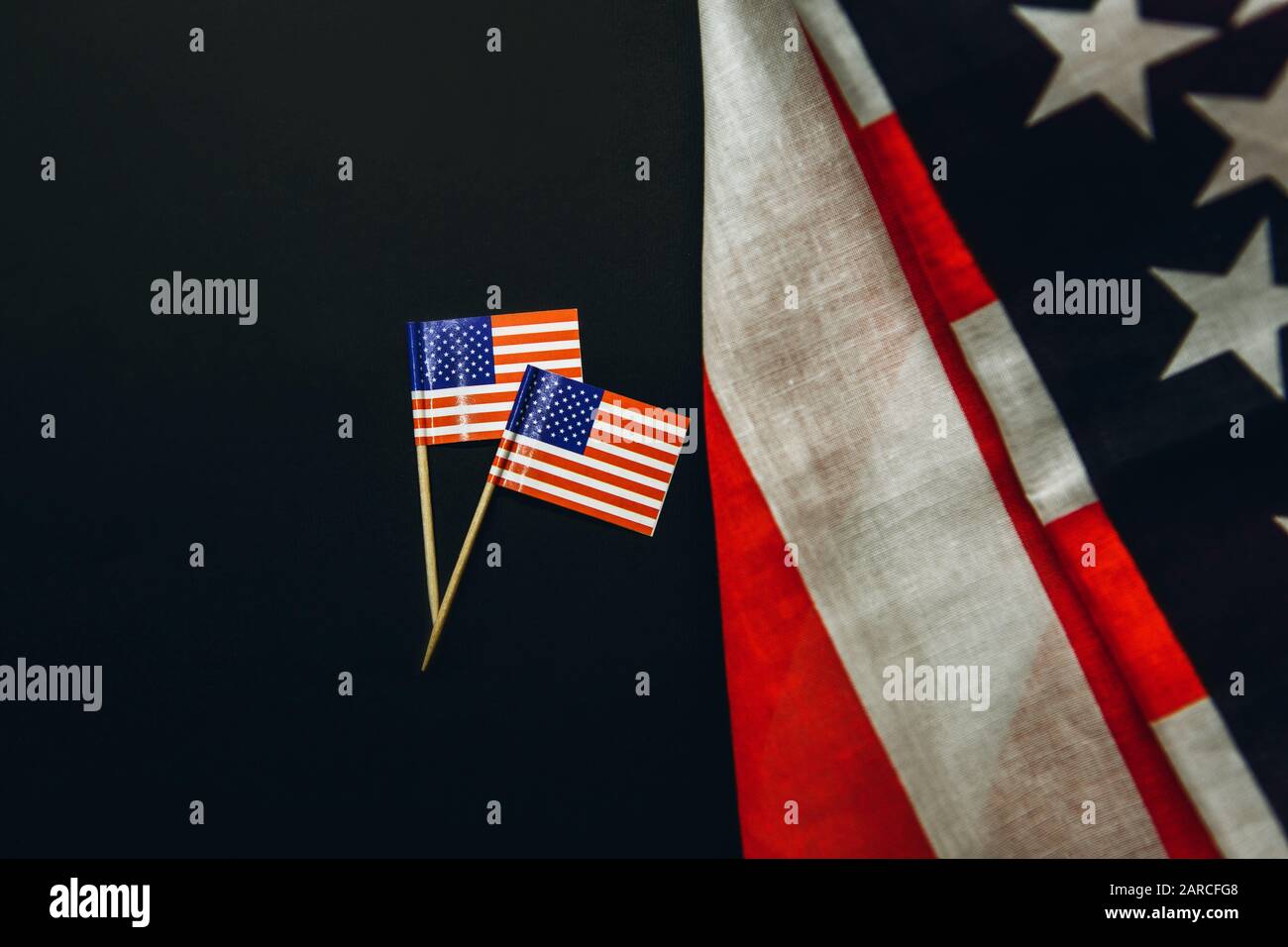 two-small-american-flags-next-to-a-large-usa-flag-patriotic-concept-or