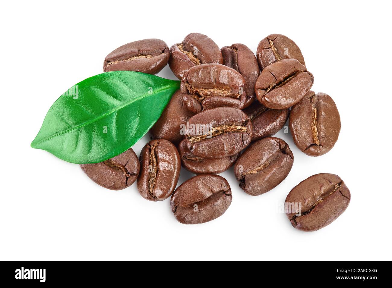 Heap of roasted coffee beans with leaves isolated on white background ...