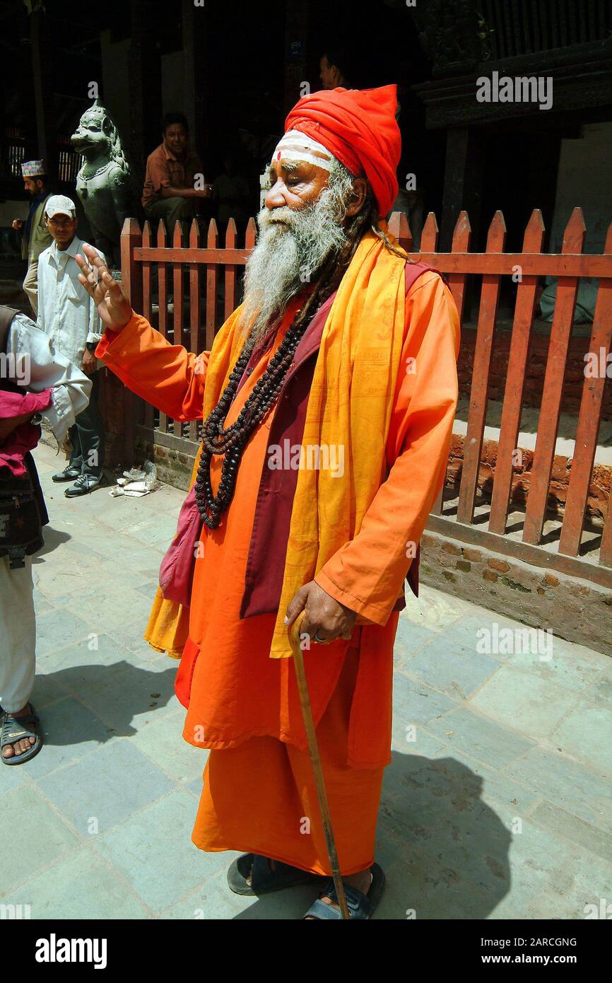 Kathmandu, Nepal - July 13, 2004: Unidentified sadhu aka saddhu in front of a hindu temple Stock Photo