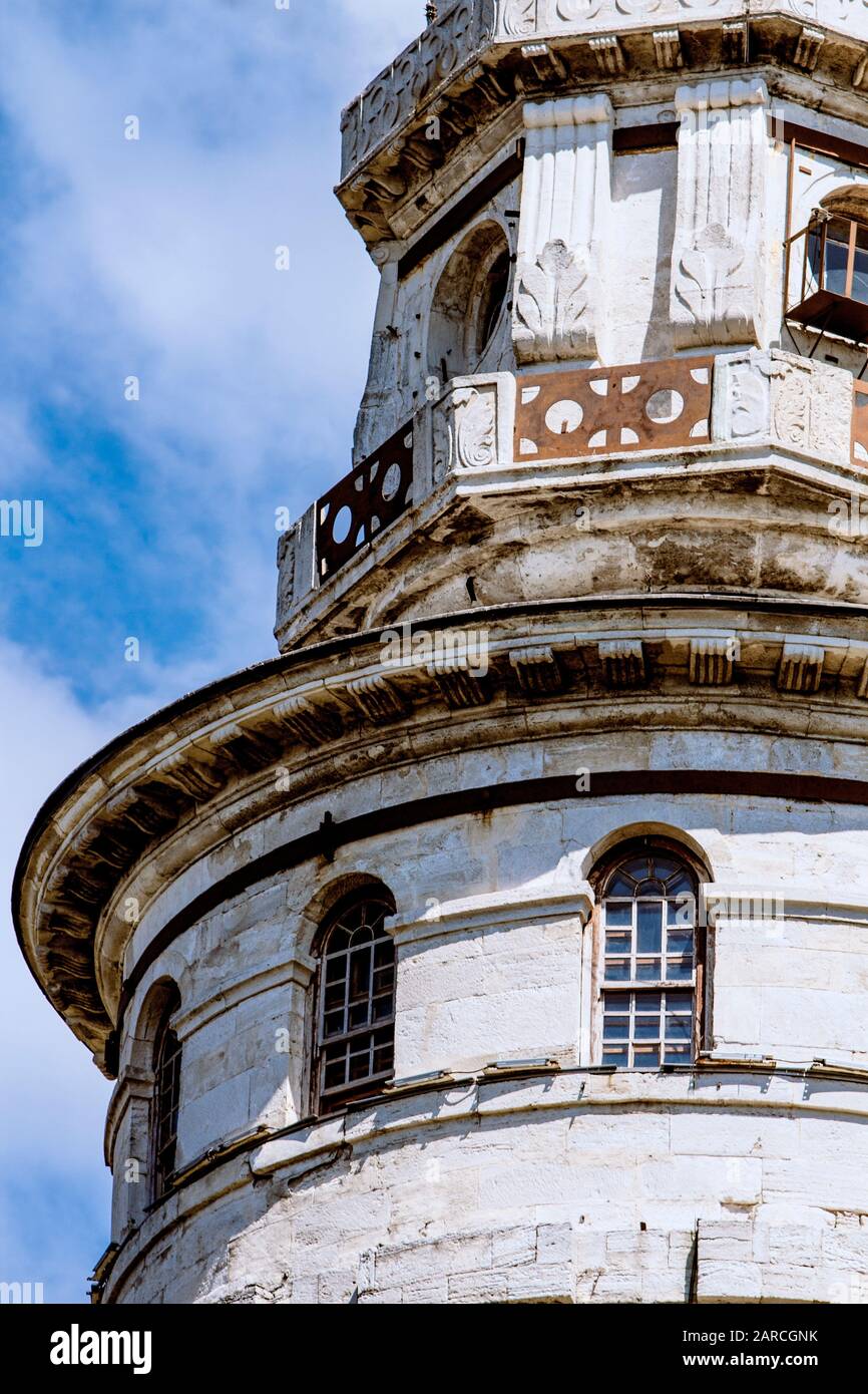 Top section detail of the Beyazit Watch Tower, used for early warning for fires and other calamities. Cloud blue sky on a sunny day. Stock Photo
