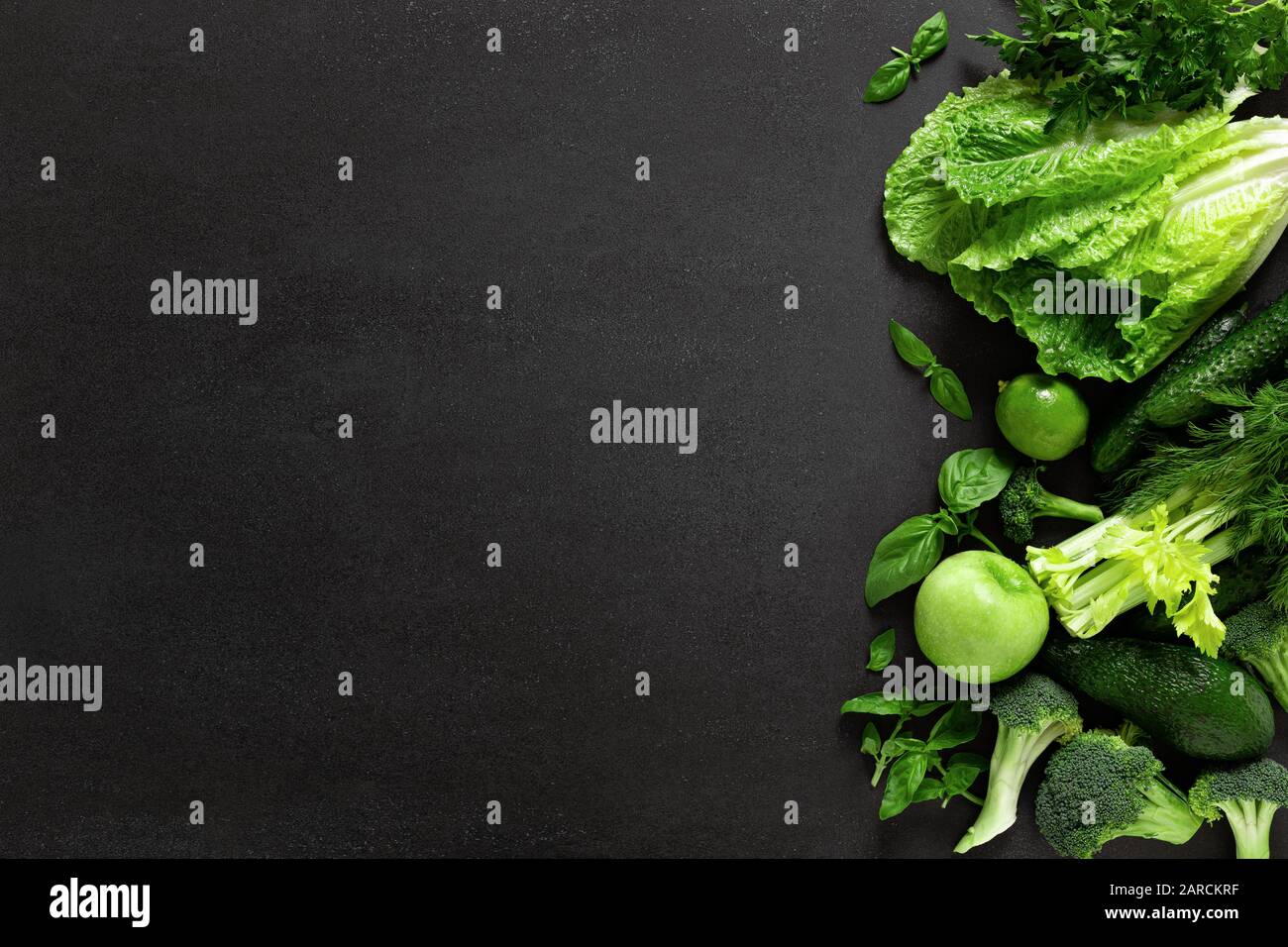 Healthy food, fresh raw green organic fruits and leafy vegetables ...