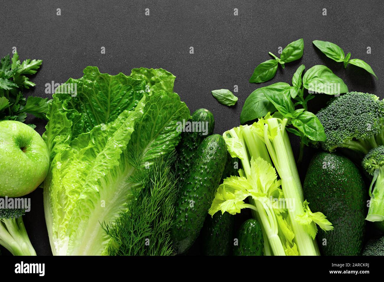 Healthy food, fresh raw green organic fruits and leafy vegetables ...