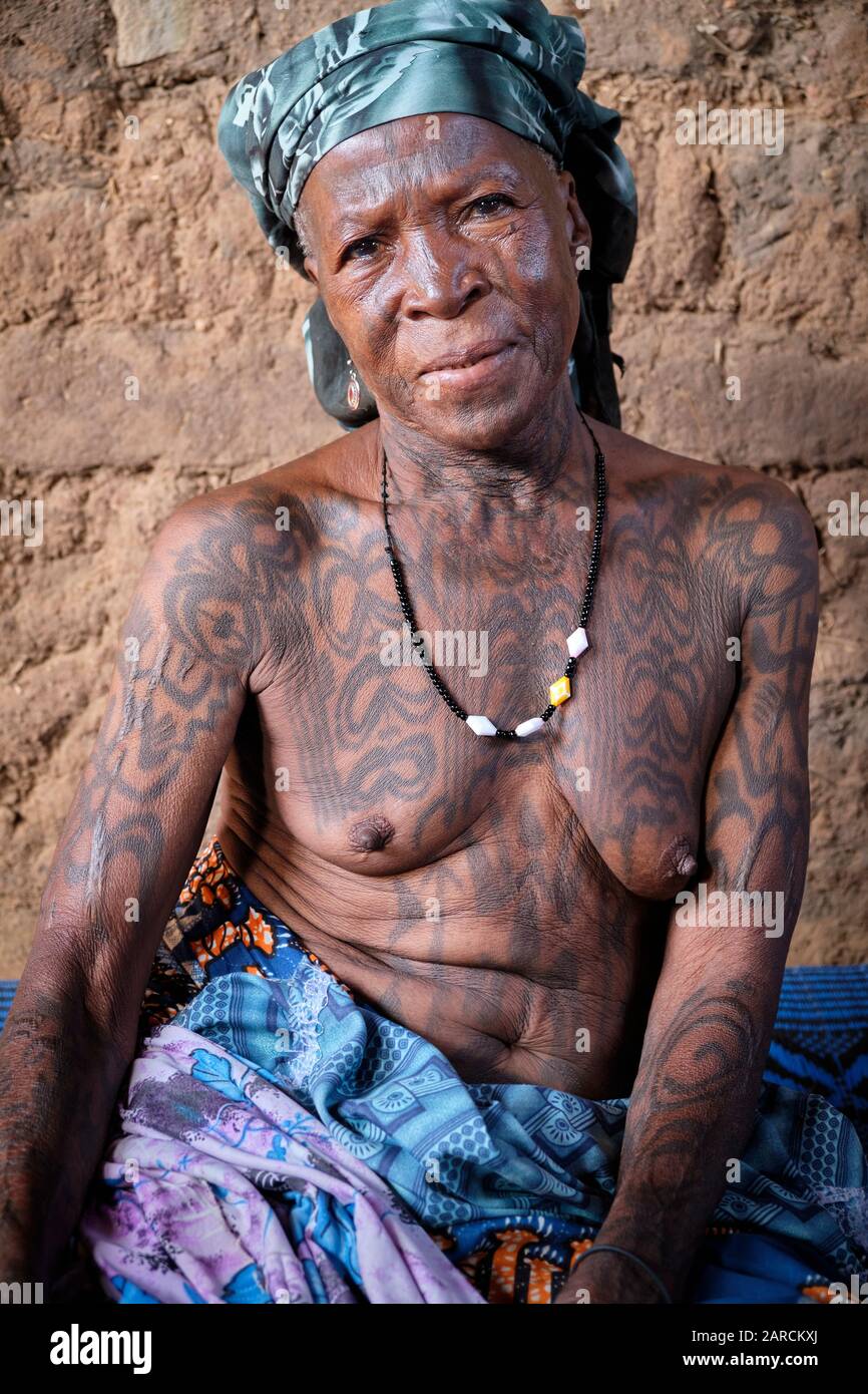 Portrait of a middle aged Dukkawa woman heavily tattooed over her body. Stock Photo