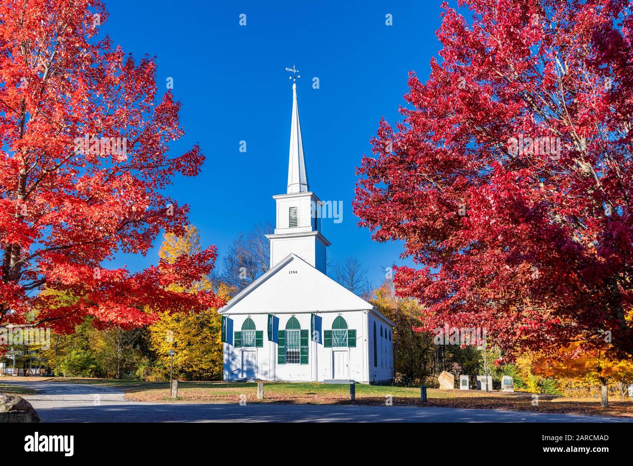 Charming New England church with autumn color. Stock Photo