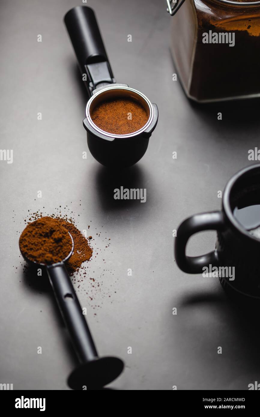 https://c8.alamy.com/comp/2ARCMWD/coffee-maker-portafilter-with-ground-coffee-spoon-coffee-cup-useful-as-background-for-barista-bar-coffee-2ARCMWD.jpg
