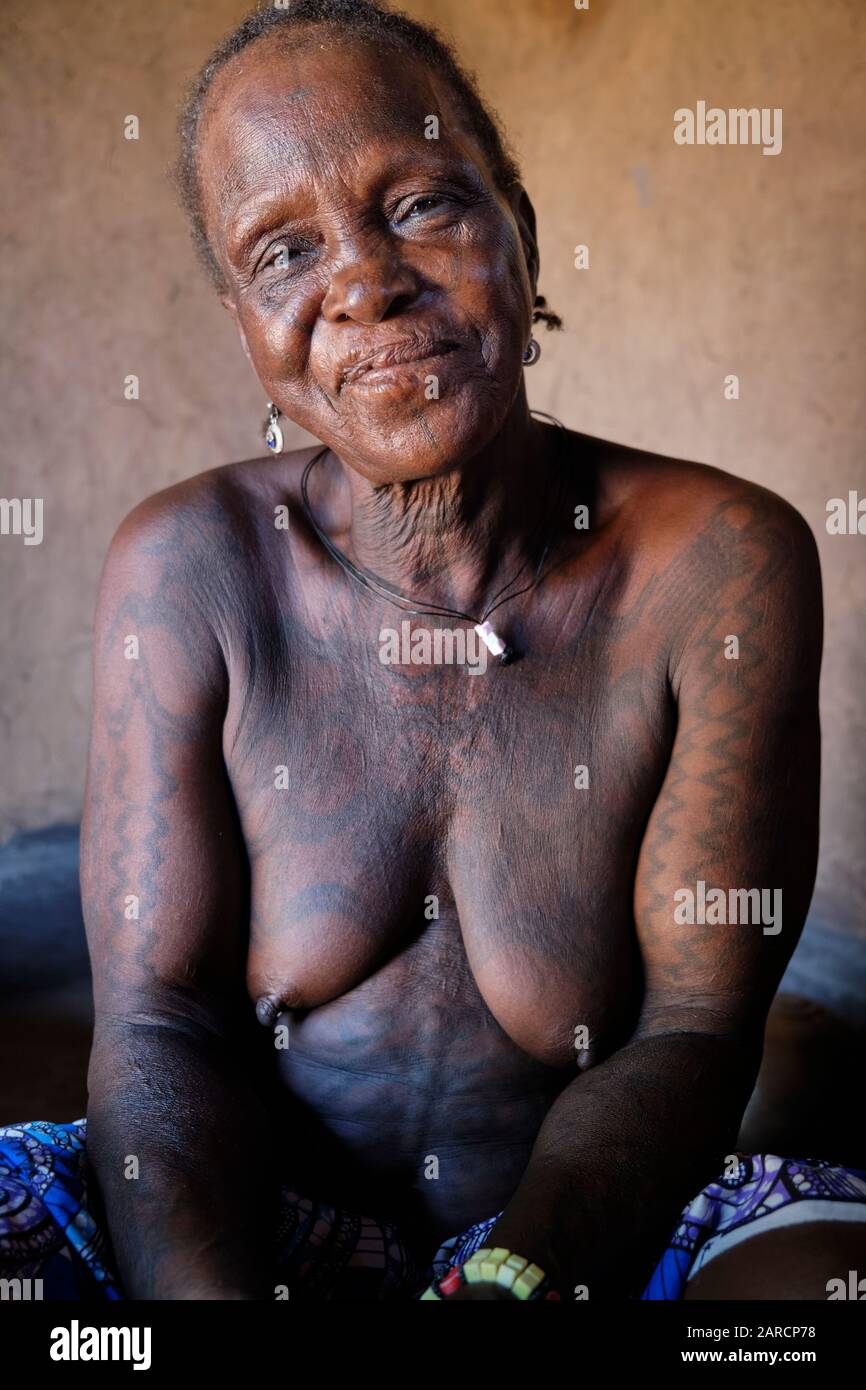 Portrait of a middle aged Dukkawa woman heavily tattooed over her body. Stock Photo