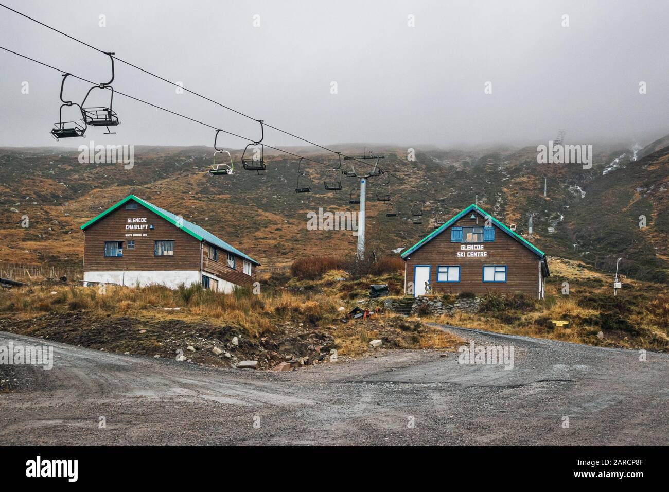 Half-empty Glen Coe ski centre on a wet, rainy day with the hills covered in dense fog. Stock Photo