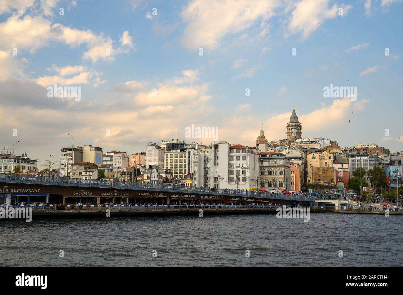 The Galata Bridge in Istanbul, Turkey. The bridge spans the Golden Horn, a natural estuary connecting the Bosphorus Strait and the Sea of Marmara. Stock Photo