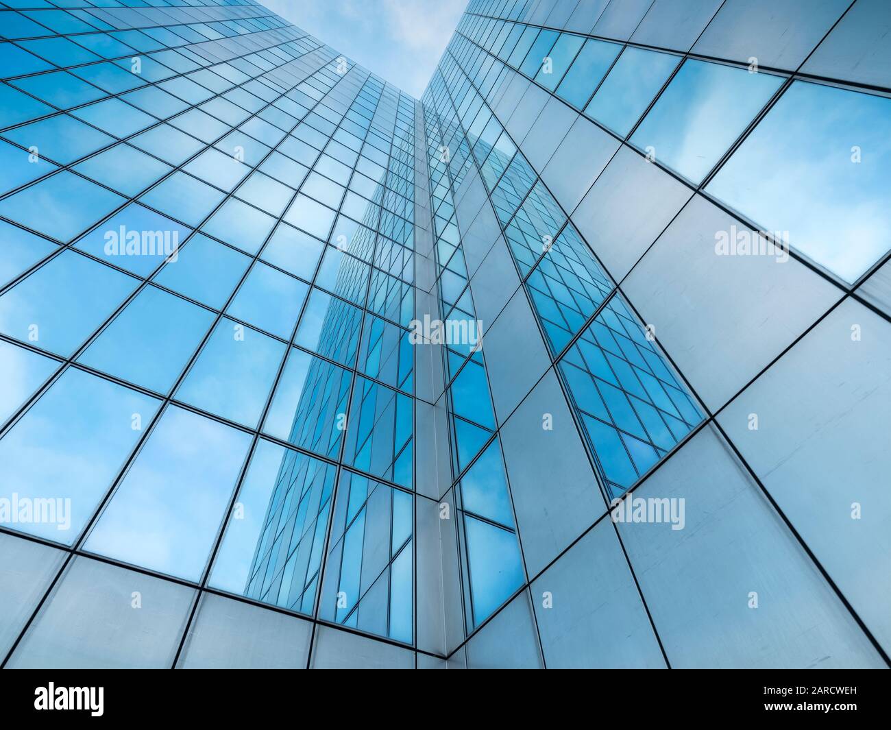 glass facades of modern office buildings and reflection of blue sky Stock Photo