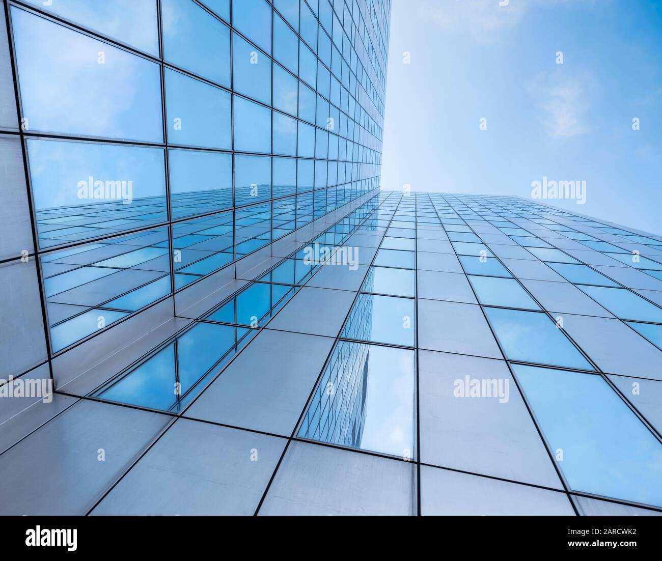 glass facades of modern office buildings and reflection of blue sky ...