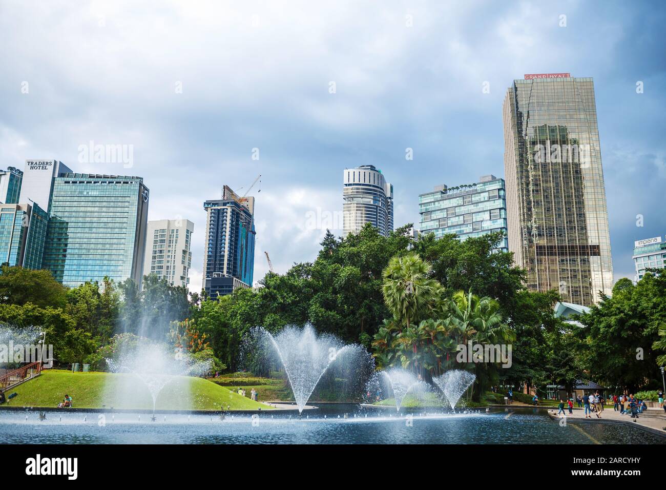 Cityscape of Kuala Lumpur. Beautiful green central park with fountains ...