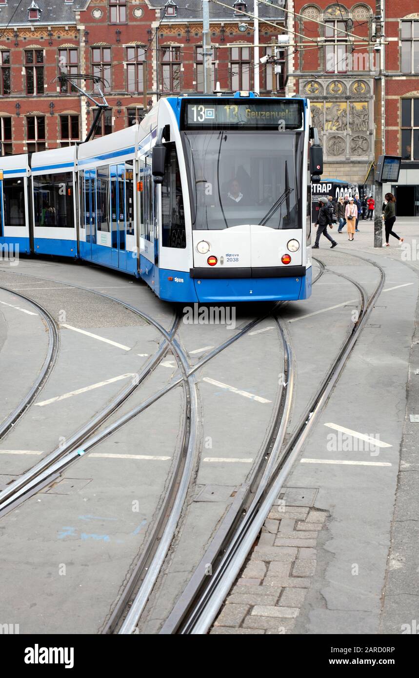 Tram in Amsterdam, The Netherlands. Amsterdam trams run on electricity produced by burning waste (in a waste-to-energy plant). Stock Photo