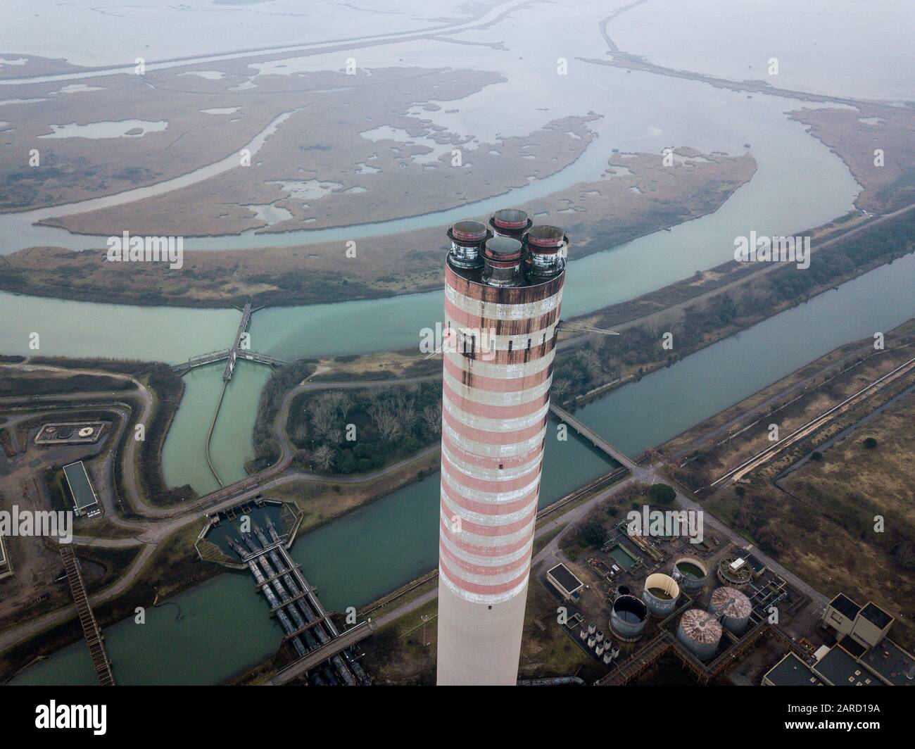 Abandoned coal power plant located in the delta of the river Po, Italy