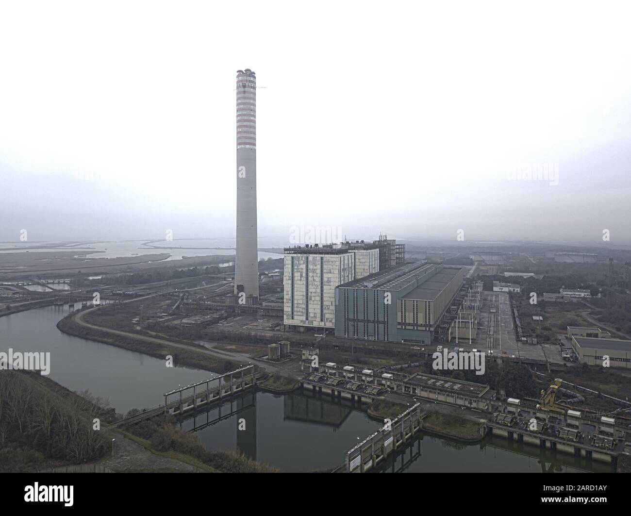 Abandoned coal power plant located in the delta of the river Po, Italy. Stock Photo
