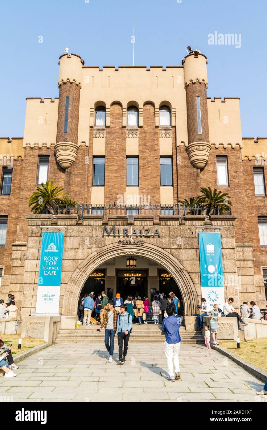 People at the entrance to the Miraiza Osaka-jo three story building containing shops and restaurants at Osaka castle. A renovated former army HQ. Stock Photo