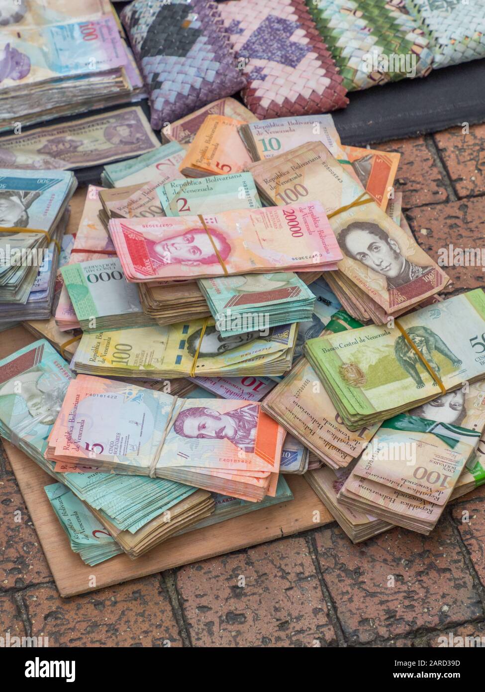 Stack of Worthless Venezuelan currency (Bolivar Fuerte) on the street of Bogota.  Due to hyperinflation  it is better to use banknotes to make purses Stock Photo