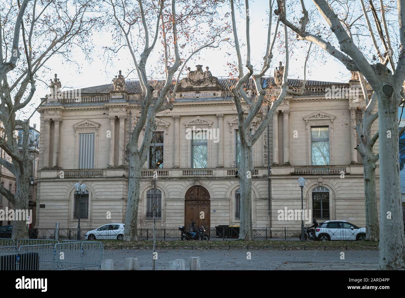 Montpellier, France - January 2, 2019: architectural detail of the Fabre museum next to the Place de la Comedie where people pass on a winter day Stock Photo