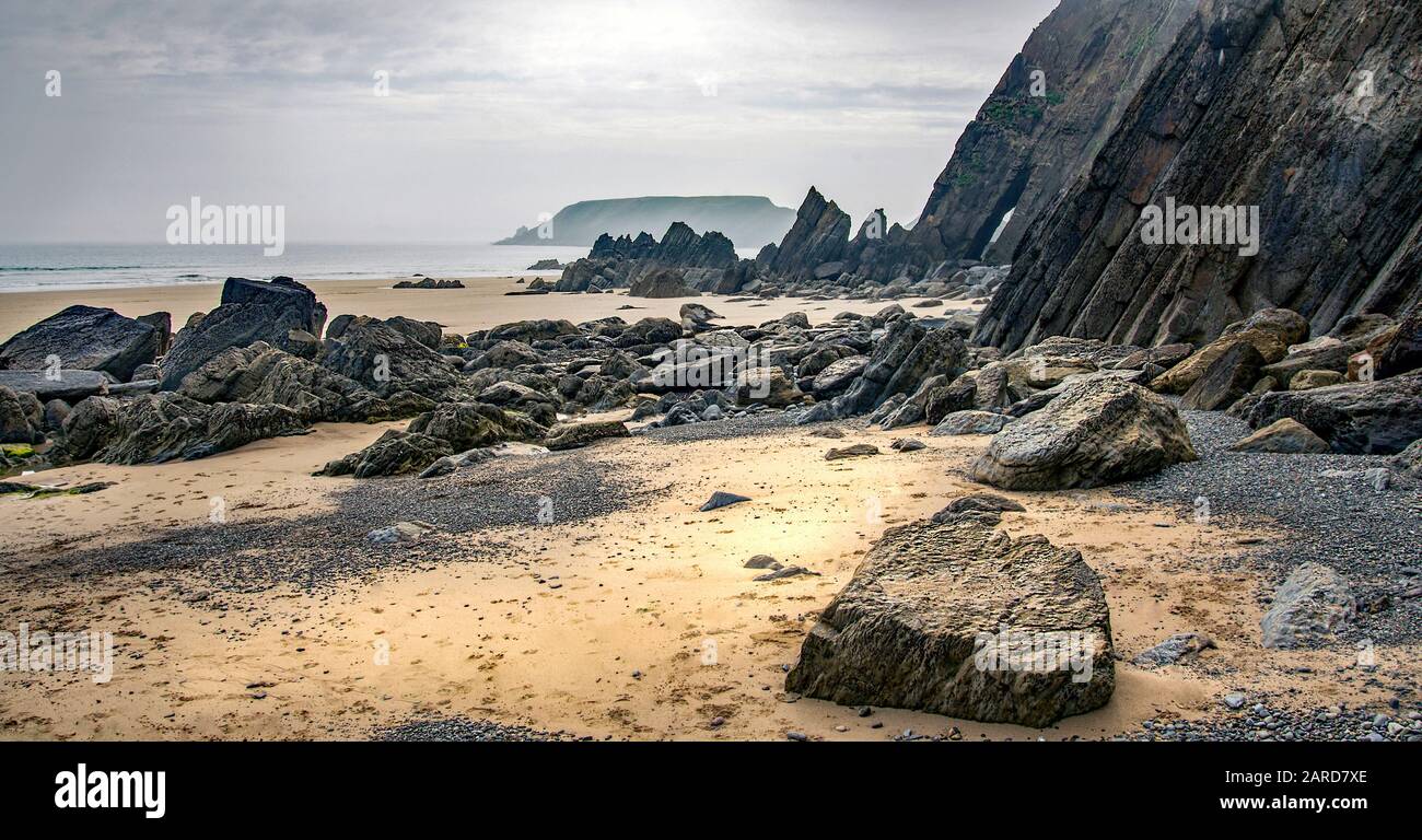 Cliffs and beach at low tide, Marloes Sands, Pembrokeshire. Stock Photo