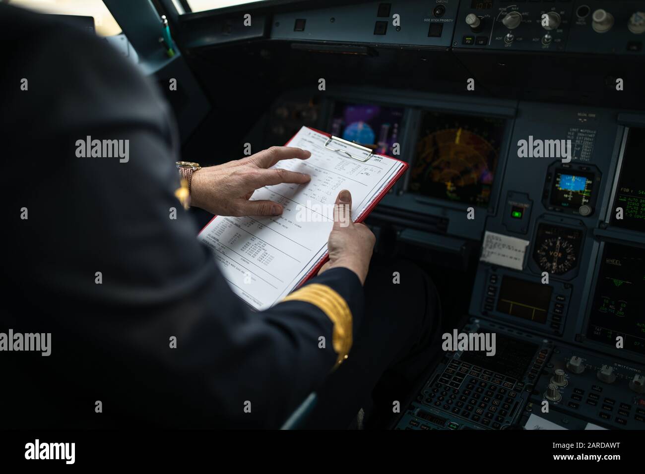 Pilot's hand accelerating on the throttle in a commercial airliner ...