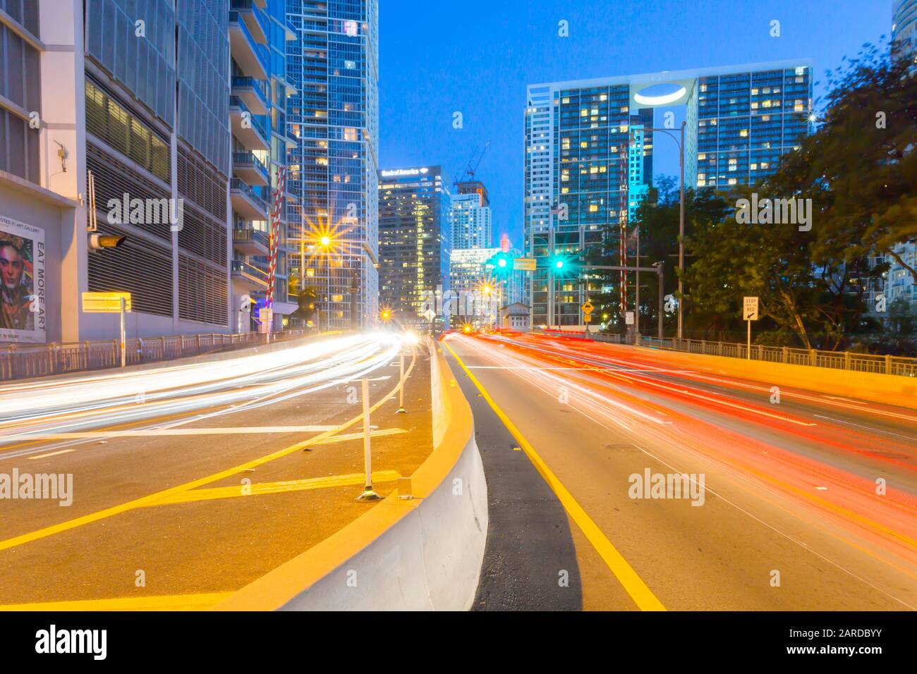 City skyscrapers and trail lights at dusk in Downtown Miami, Miami, Florida, United States of America, North America Stock Photo