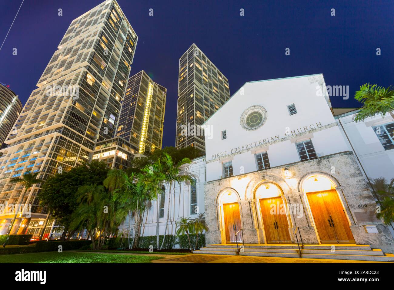 City skyscrapers and First Presbyterian Church at dusk in Downtown Miami, Miami, Florida, United States of America, North America Stock Photo