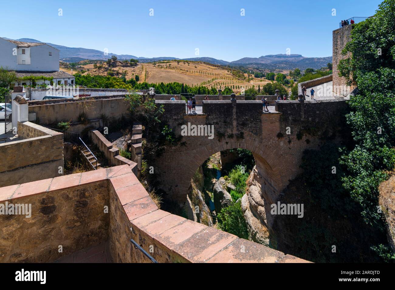 Ronda, Spain 08/17/2019; The old bridge was built in 1616, crosses the Guadalevin river, is 10 meters long and has a height of 30 meters. Stock Photo