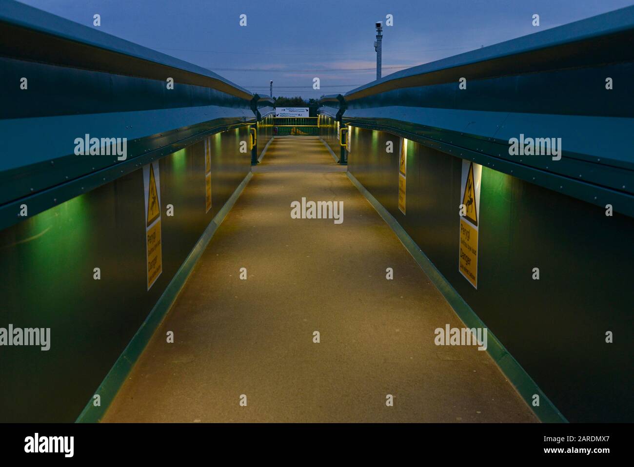 An illuminated bridge at Severn Tunnel Junction railway station in