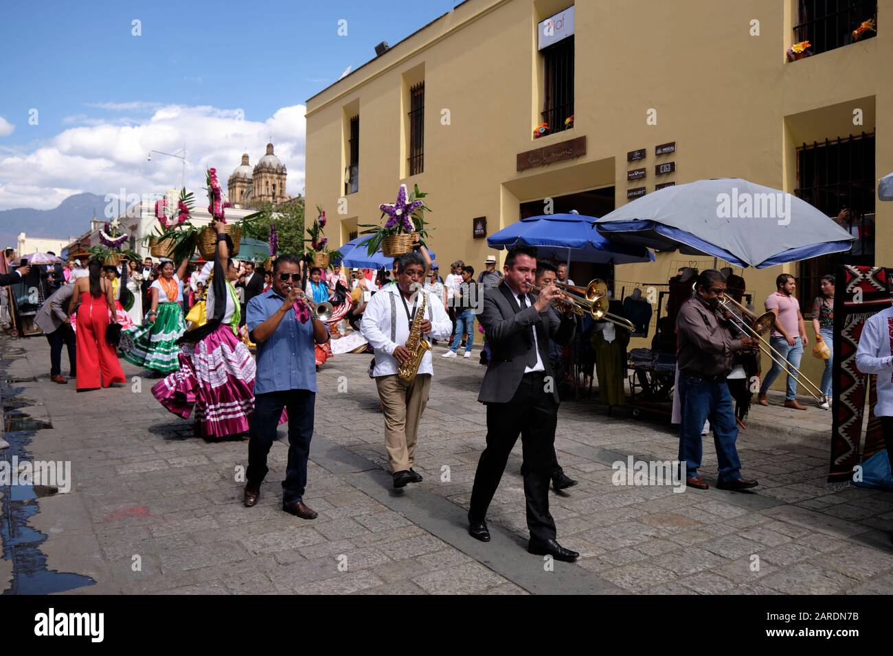 Band leading way from church part of Traditional wedding parade (Calenda de Bodas) on the streets of Oaxaca. Stock Photo