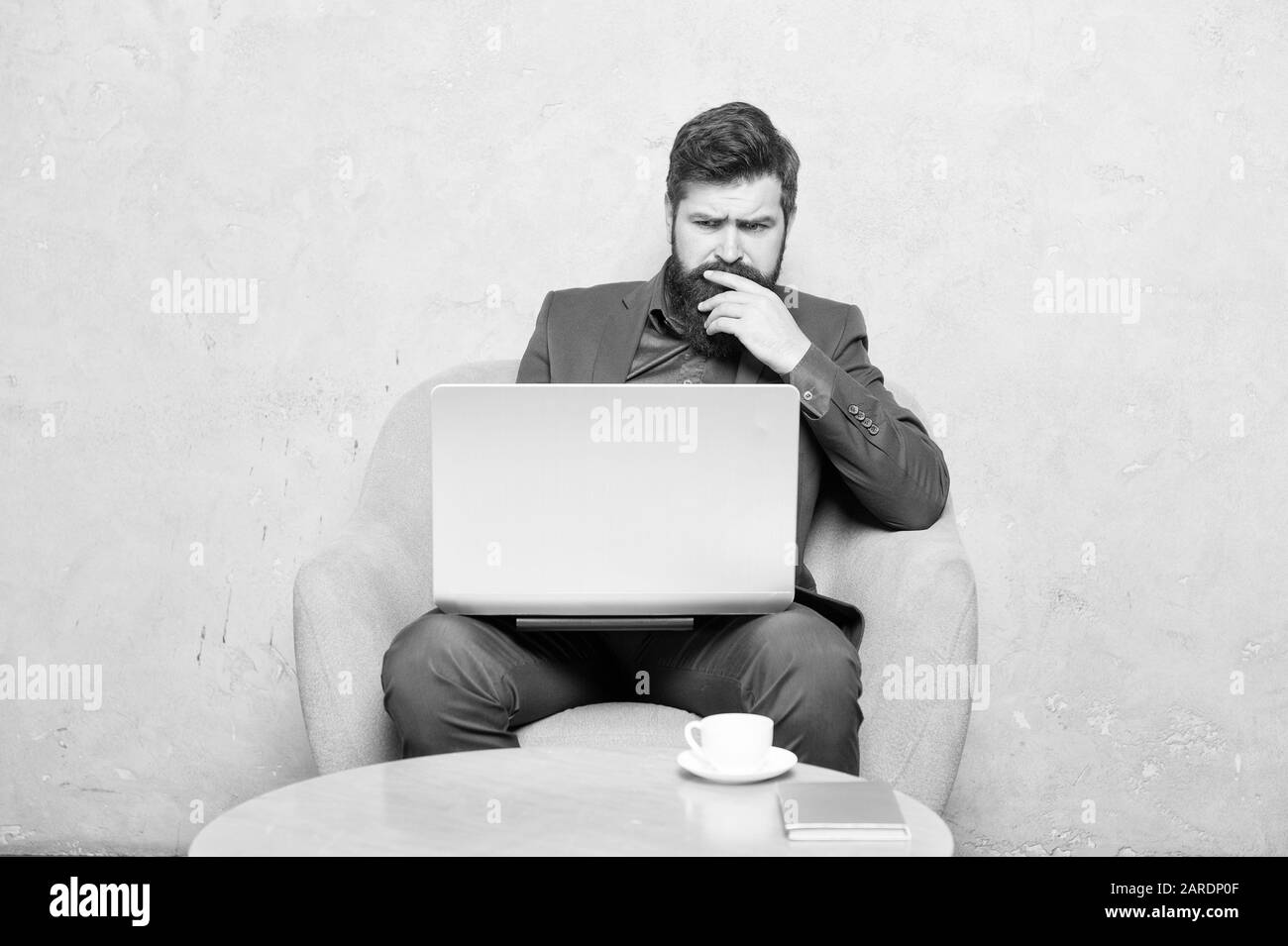 Blogging is a must for any company. Bearded man blogging on popular social network. Professional journalist blogging and writing articles on workplace. Blogging and advertising. Stock Photo