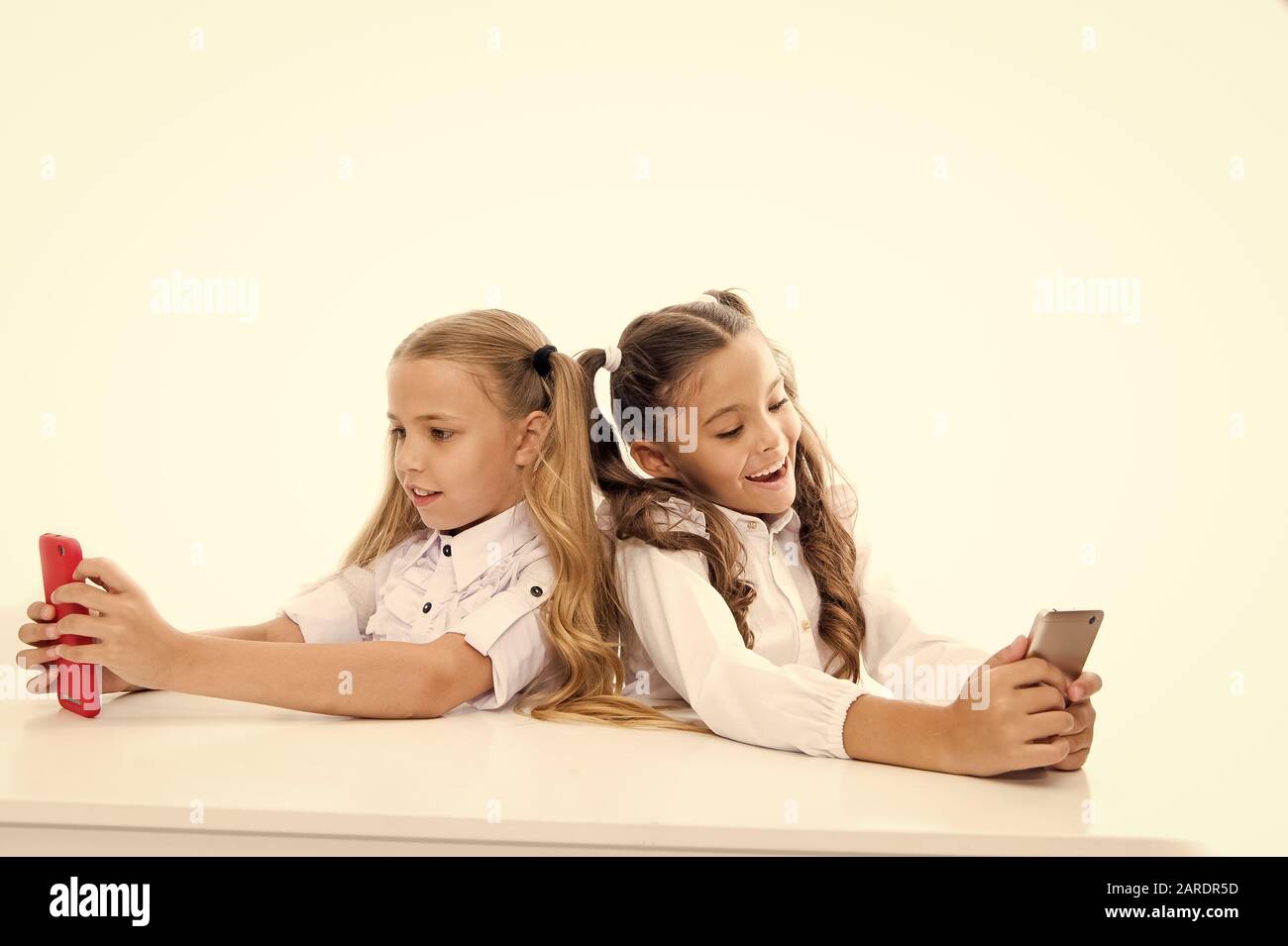 Bring the power of mobile learning into the classroom. Small children having lesson on mobile