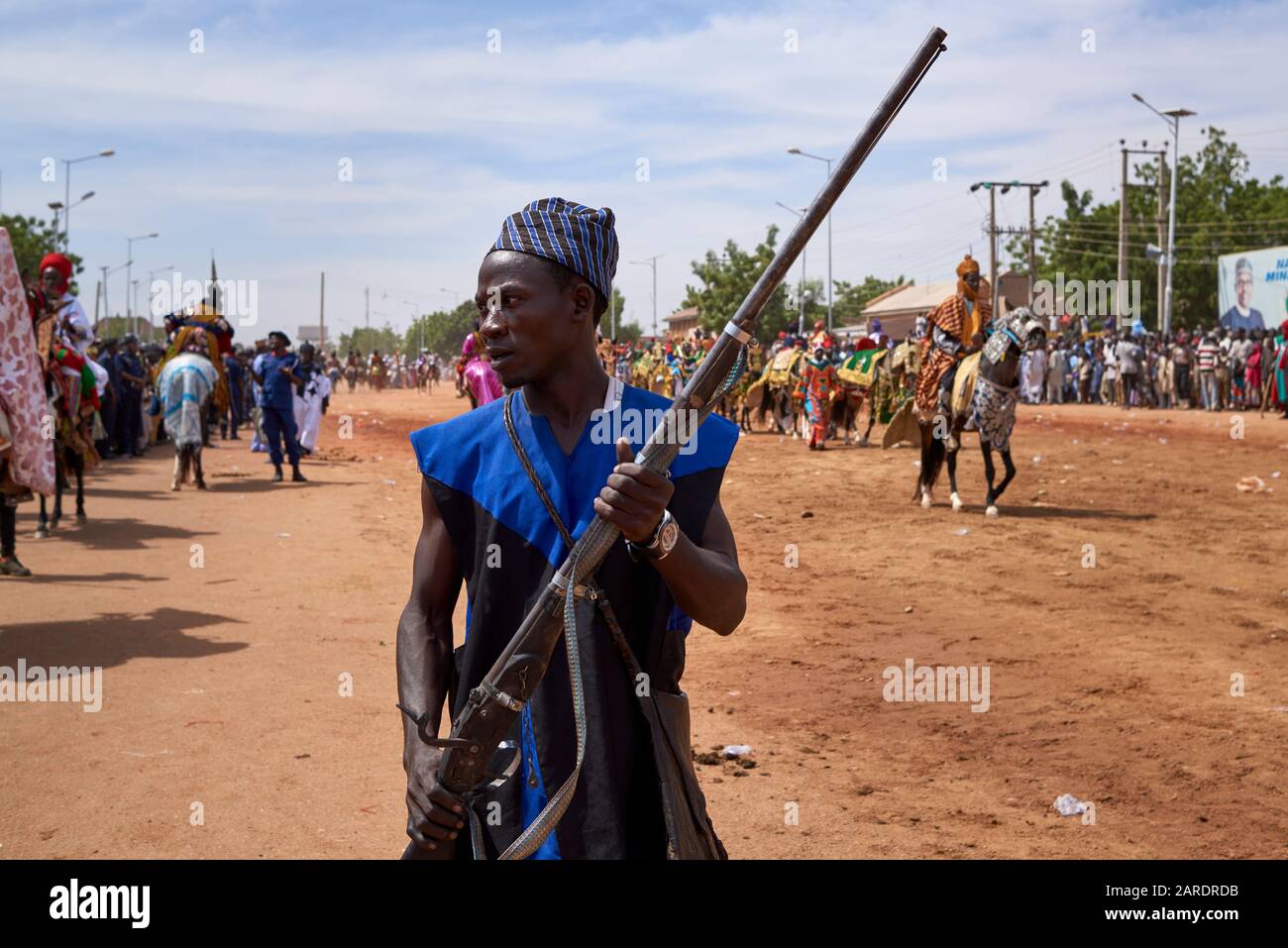 Man with an old musket participating in a durbar parade. A durbar is a celebration in northern Nigeria in which the noblemen of the area pay respects Stock Photo