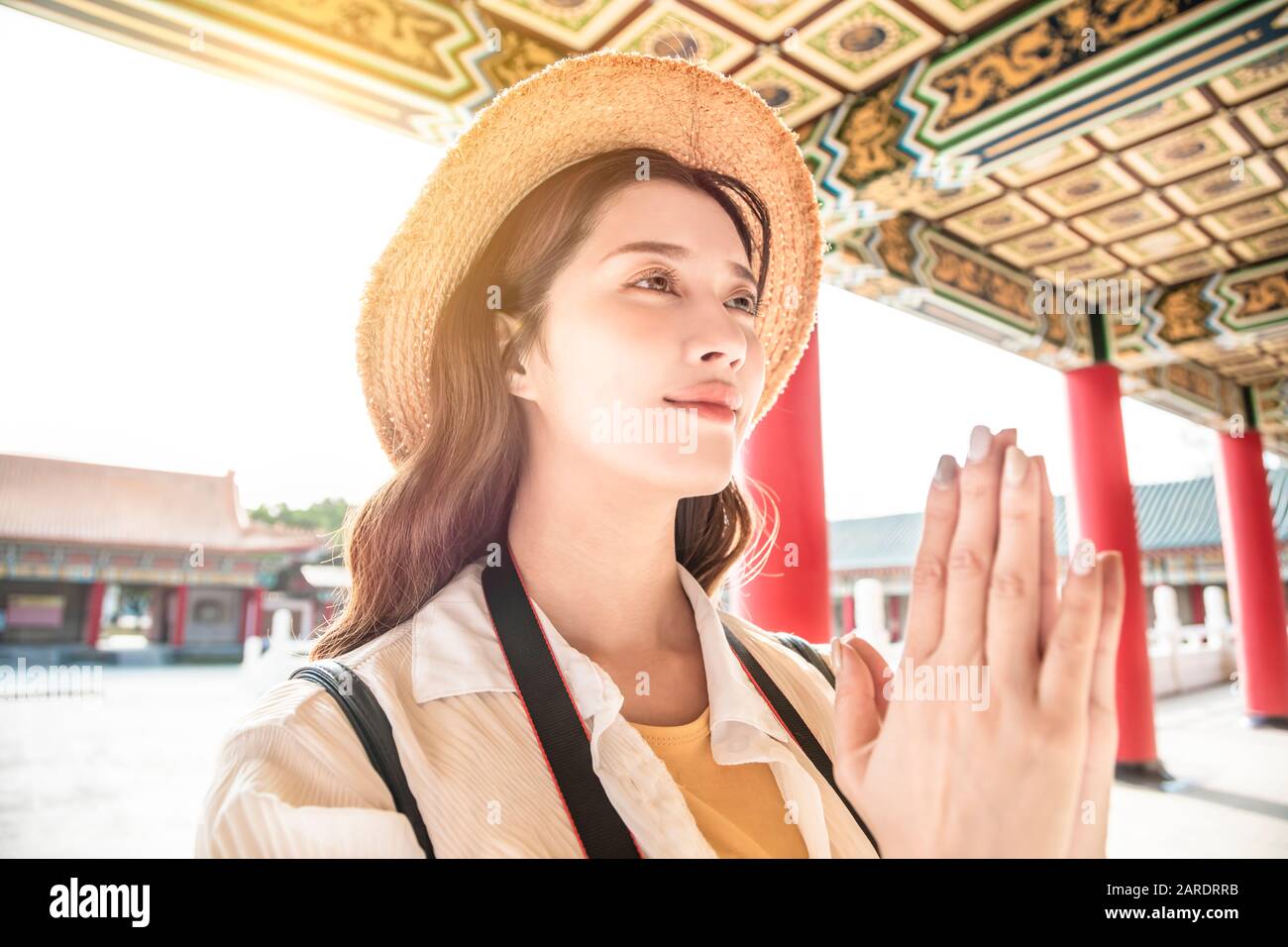 tourist beautiful asian young woman praying at chinese temple Stock Photo