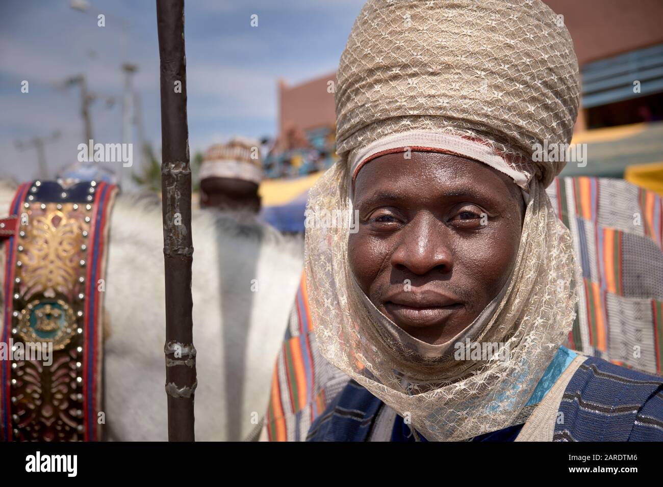 Page wearing a fine turban scorting his master dressed in a colourful  outfit during the celebration of a durbar Stock Photo - Alamy