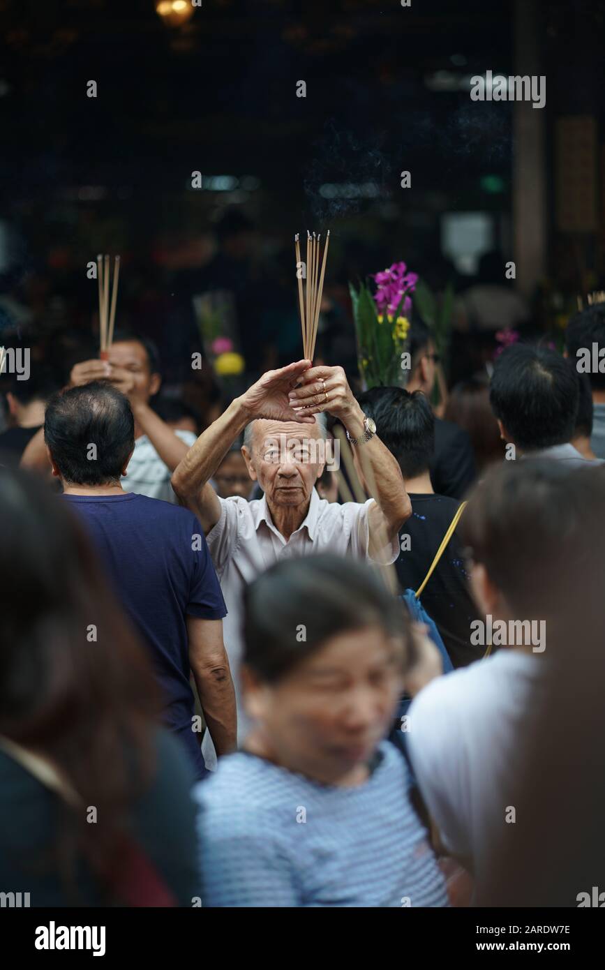 Crowd at Guan Yin Temple In Singapore during Vesak Day people praying Stock Photo