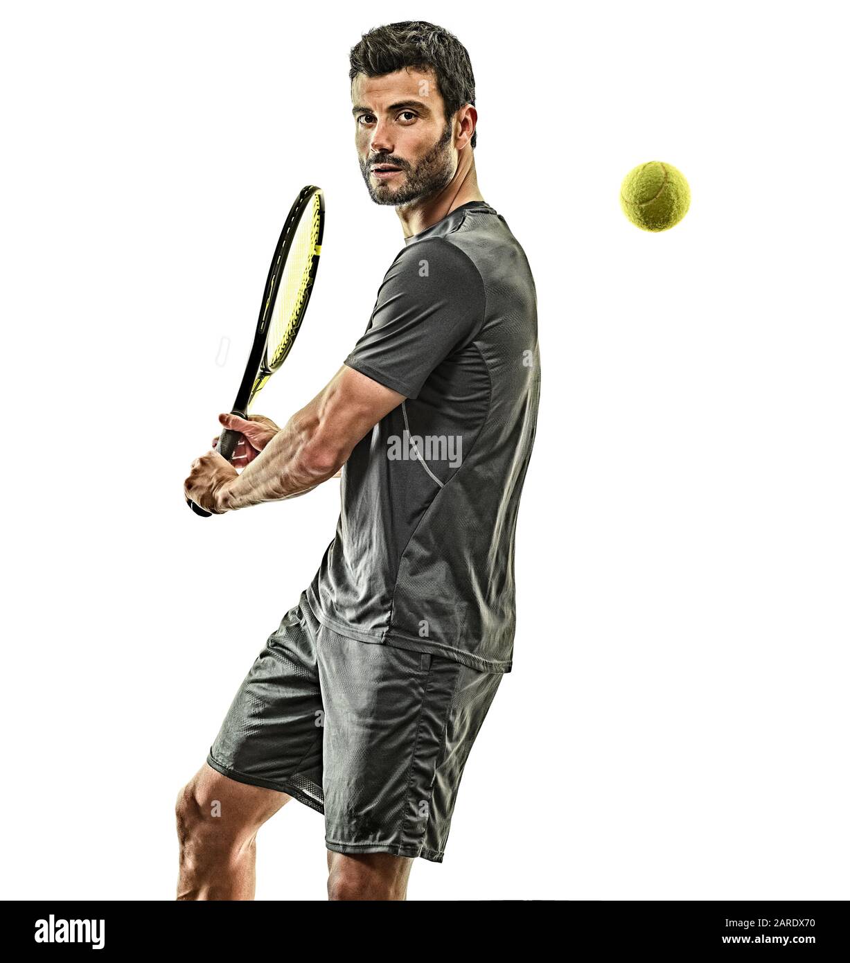 one caucasian mature tennis player man backhand in studio isolated on white background Stock Photo