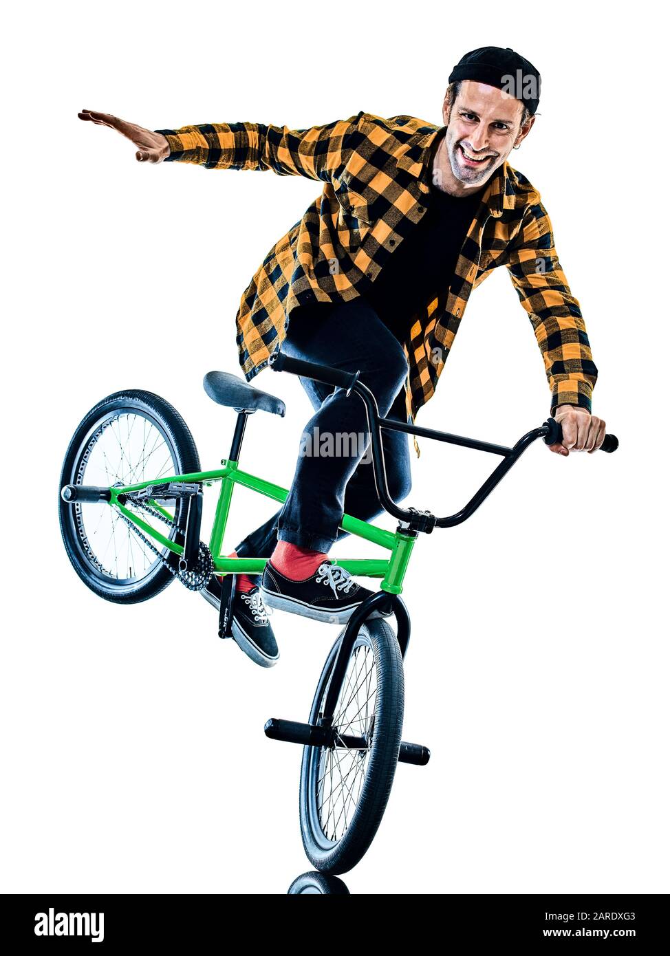 one young caucasian man BMX rider cyclist cycling freestyle acrobatic stunt in studio  isolated on white background Stock Photo