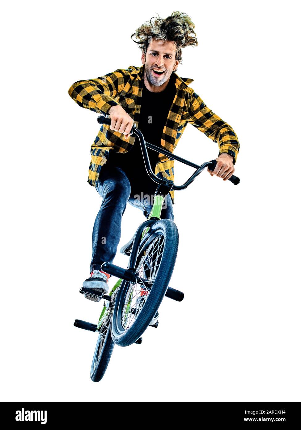 one young caucasian man BMX rider cyclist cycling freestyle acrobatic stunt in studio  isolated on white background Stock Photo