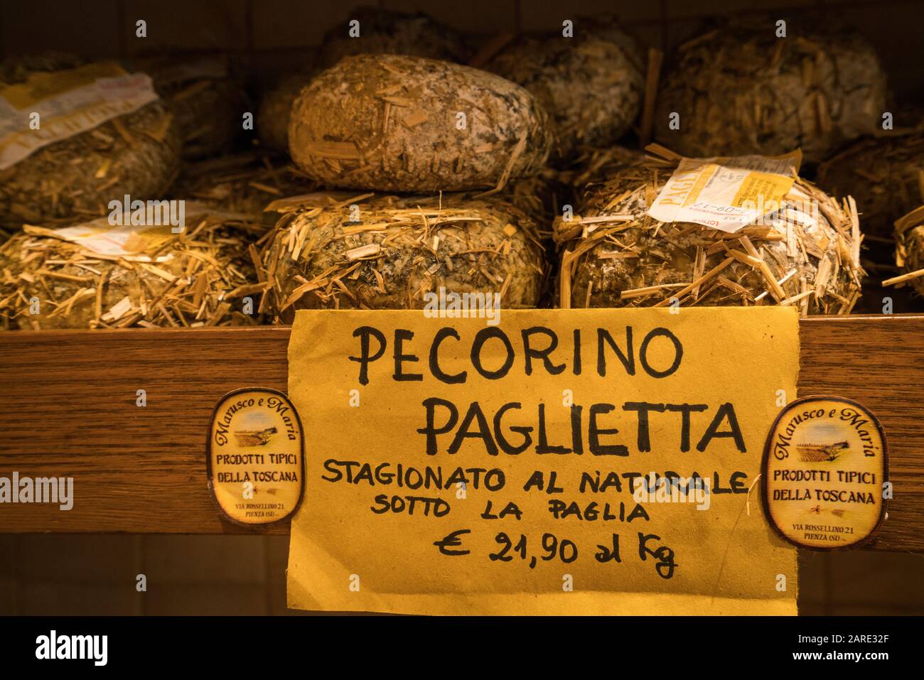 Pienza, Italy - Pecorino sheep cheese aged between 10-20 days for sale in a shop in the medieval vlilage of Pienza, Tuscany Stock Photo