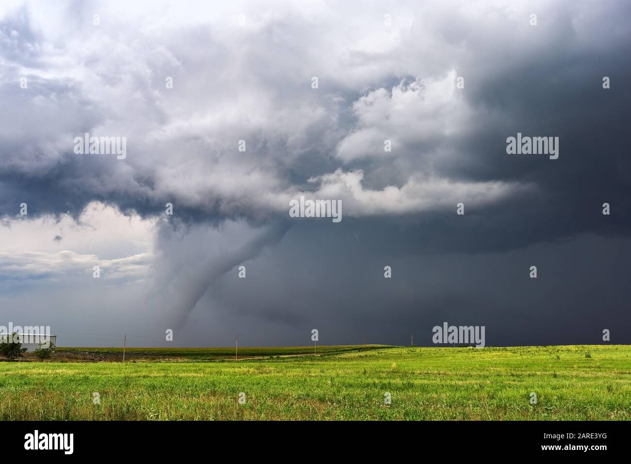 Supercell tornado touching down beneath a thunderstorm near Otis, Colorado Stock Photo