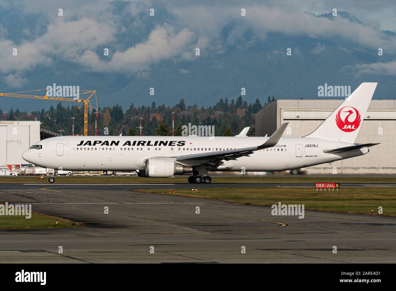 Japan Airlines JAL plane Boeing 767-300ER (767-346ER) twin-engine wide-body jet airliner takes off from Vancouver International Airport Stock Photo