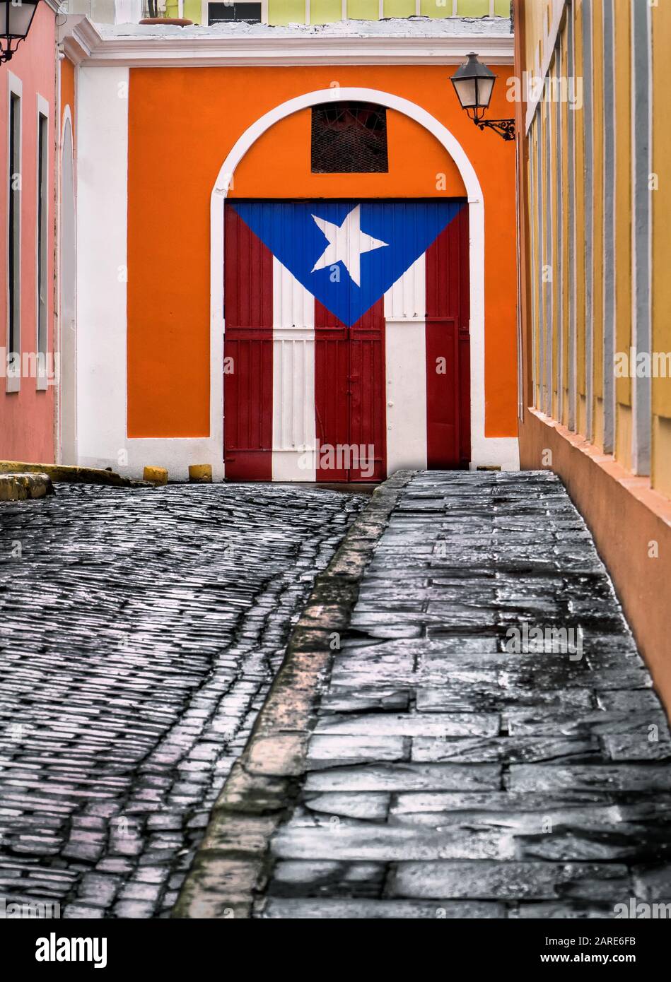 Cobblestone alley , Old San Juan Puerto Rico. Building decorated with