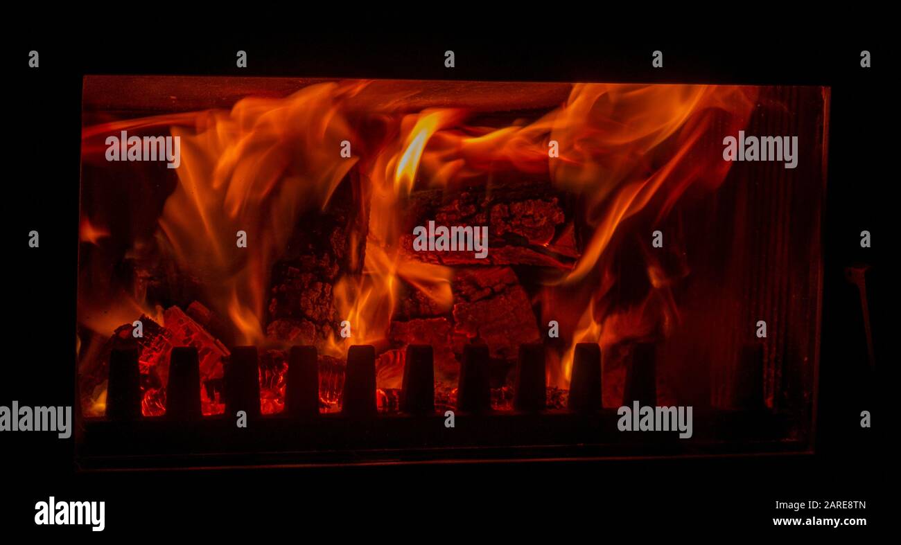 Closeup shot of burning wood in a fireplace Stock Photo