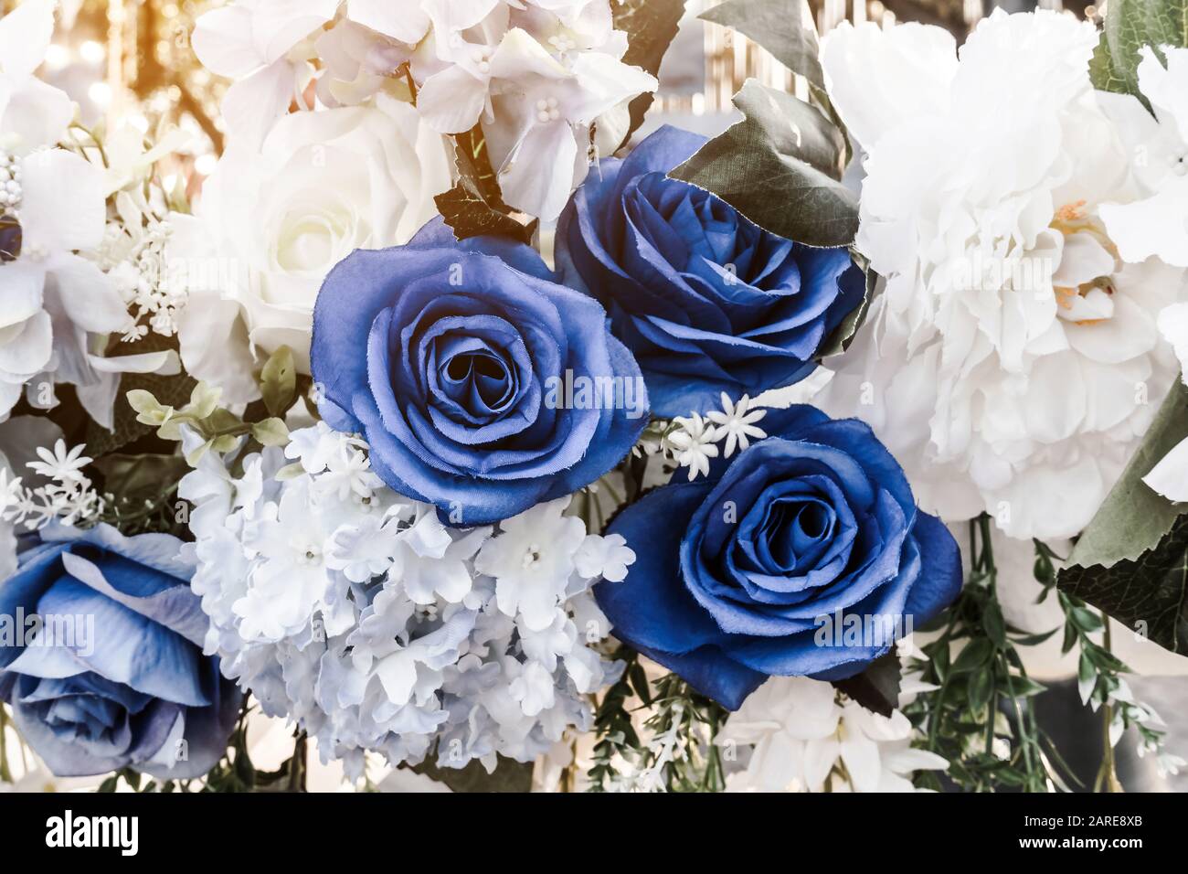 Artificial Blue And White Flowers Decorate The Arch As The