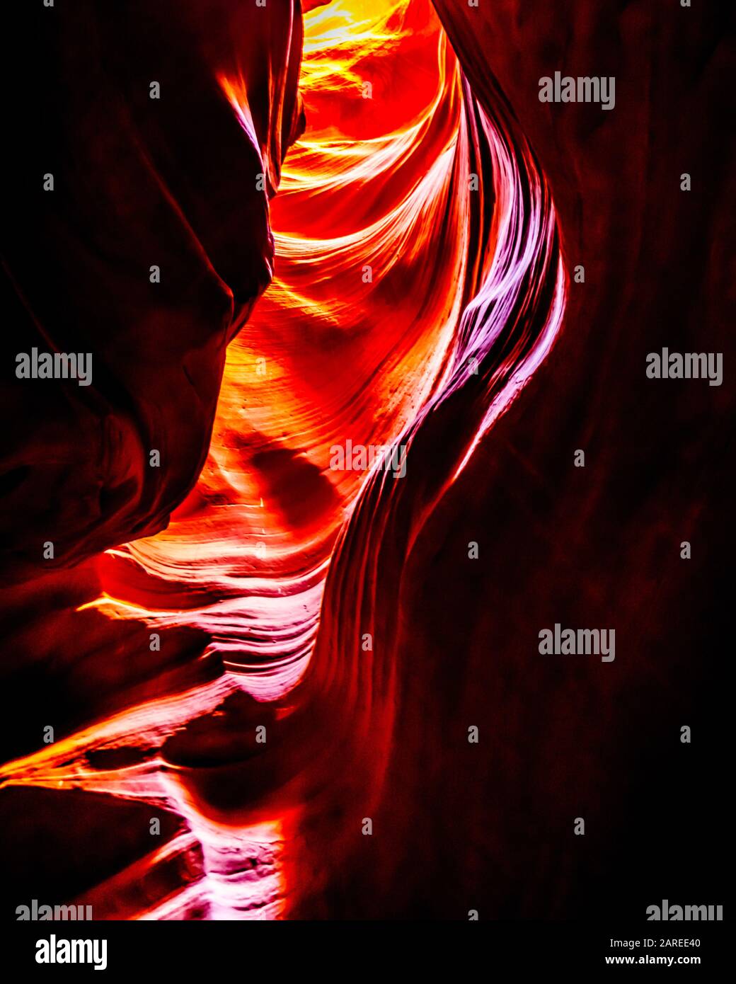 The smooth curved Red Navajo Sandstone walls of the Upper Antelope Canyon, one of the famous Slot Canyons in the Navajo lands near Page Arizona, USA Stock Photo