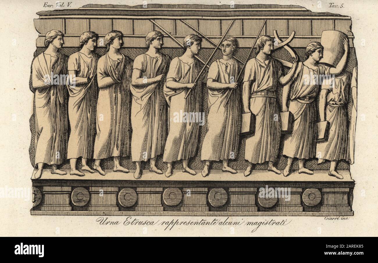 Magistrates from an ancient Etruscan urn. President with curule seat, four praetors or judges in short-sleeved tunics. Urna Etrusca rappresentante alcuni magistrati. Handcoloured copperplate engraving by Giarre from Giulio Ferrario’s Costumes Ancient and Modern of the Peoples of the World, Il Costume Antico e Moderno, Florence, 1843. Stock Photo