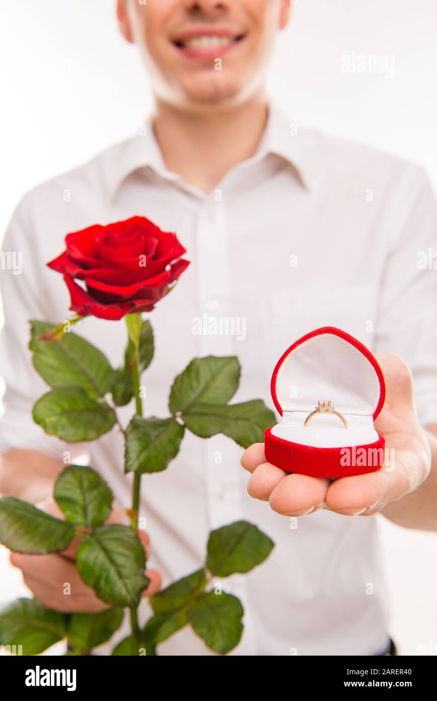 Close up portrait of man with rose and wedding ring going to make proposal  Stock Photo - Alamy